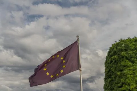 EU flag flying on pole Stock Photos