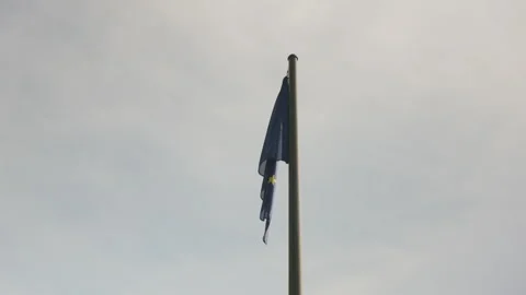 EU Flag Hanging Motionless Under Cold Blue Winter Sky 스톡 동영상 326532430