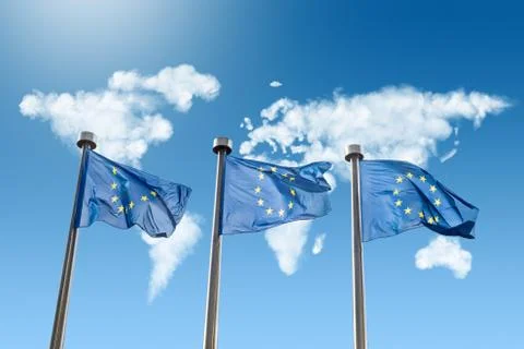 EU flags against world map made of clouds 스톡 사진