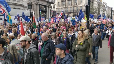 EU flags waving as protesters march against Brexit Stock Footage 118277253