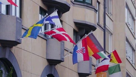 EU states flags blowing in the wind outside the EU parliament Video stock 142729278
