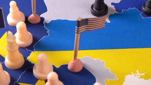 EU, USA and Russian flags with chess pieces symbolizing the conflict and control Stock Footage 169747503