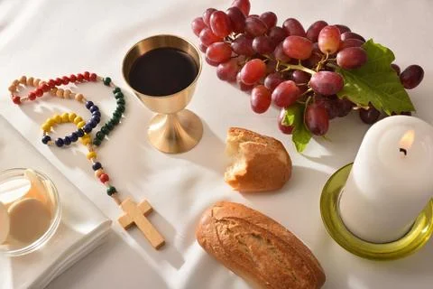 Eucharistic elements on table with white tablecloth Stock Photos