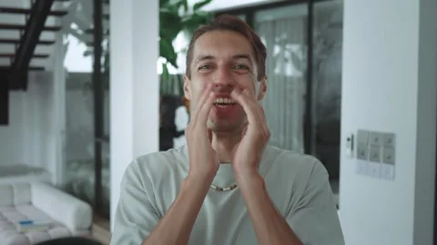 Euphoric expression millennial guy looking at camera face lighting up with Stock Footage 312502632