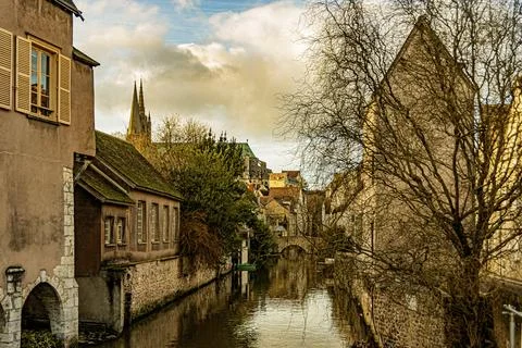 The Eure River at Chartres and at background the domes of our lady basilica.. Stock Photos