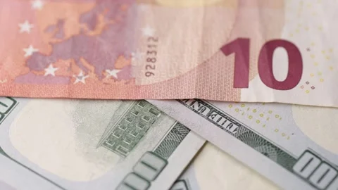 Euro and dollar banknotes rotating together in macro layered arrangement se.. Stock Footage 323975107