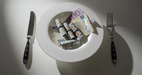 Euro and Dollar Banknotes on White Plate with Fork and Knife, Wealth Concept Stock Footage 346540938