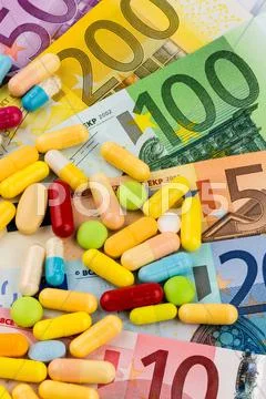 Euro bank notes and tablets Stock Photos