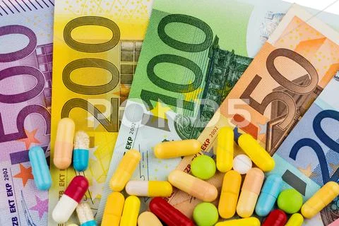 Euro bank notes and tablets Stock Photos