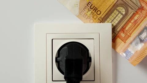 Euro banknote placing behind electrical socket with electric plug Stock Footage 248380073