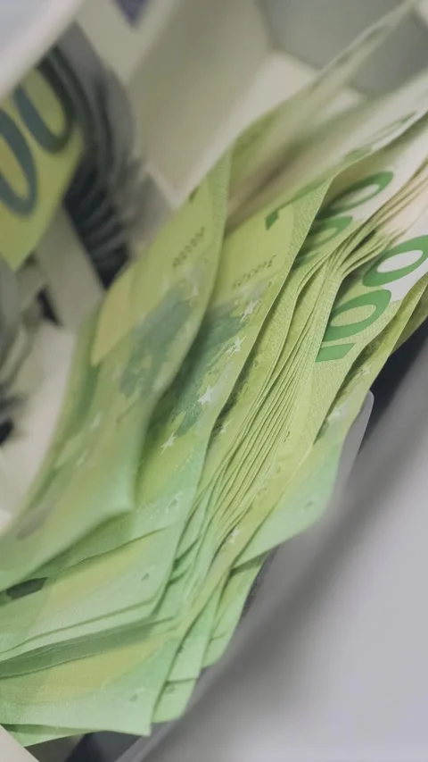 Euro banknotes are being processed quickly through an automatic money counting Stock Footage 317737211