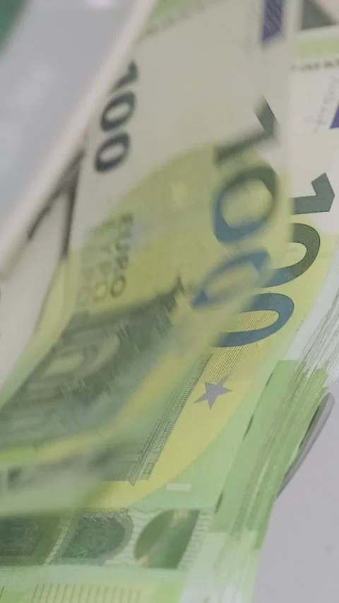 Euro banknotes are being processed quickly through an automatic money counting Stock Footage 317737213