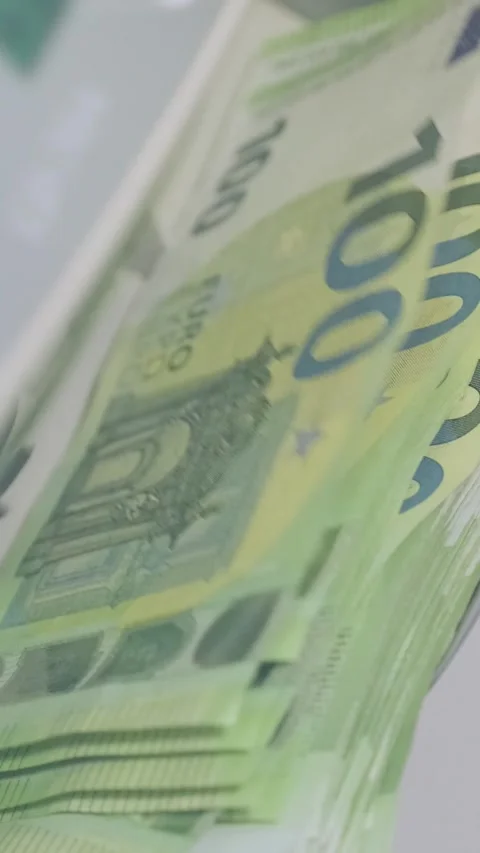 Euro banknotes are being processed quickly through an automatic money counting Stock Footage 317737217