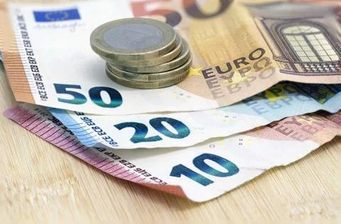 Euro banknotes with coins Stock Photos