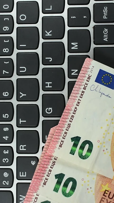 Euro banknotes on Computer Keyboard vertical video Stock Footage 340389177
