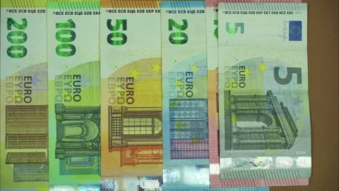 Euro banknotes of different nominal value on braun background. Stop motion Stock Footage 287950107