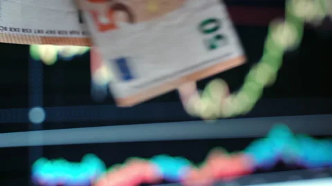 Euro banknotes falling down on background of dynamic financal diagrams, concept Stock-Footage 131720118