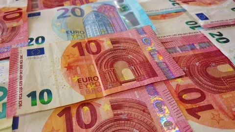 Euro banknotes falling on a table covered with banknotes. Close up Stock Footage 146282530