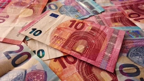 Euro banknotes falling on a table covered with banknotes. Close up Stock Footage 146282637