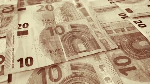 Euro banknotes falling on a table covered with banknotes. Close up Stock Footage 146282674