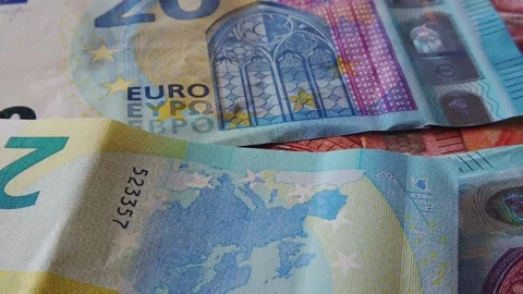 Euro banknotes falling on a table covered with banknotes. Close up Stock Footage 146282912