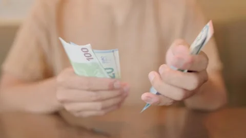 Euro banknotes in the hands of an elderly man. The pensioner is counting cash Stock Footage 252071575