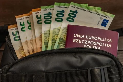Euro banknotes hidden in an ID document. Money sticking out of a passport. .. Stock Photos