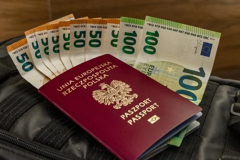 Euro banknotes hidden in an ID document. Money sticking out of a passport. .. Stock Photos