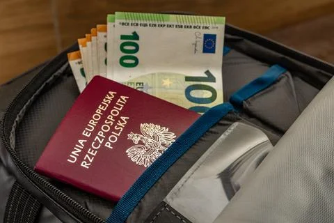 Euro banknotes hidden in an ID document. Money sticking out of a passport. .. Stock Photos