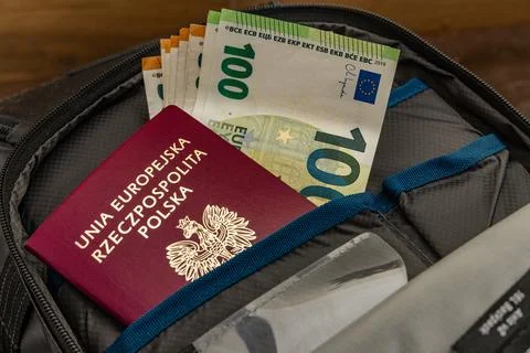 Euro banknotes hidden in an ID document. Money sticking out of a passport. .. Stock Photos