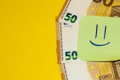Euro banknotes with notes on yellow background isolated. Covid, Coronavirus.C Stock Photos
