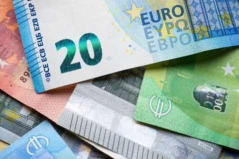 Euro banknotes piled up on a table. Stock Photos