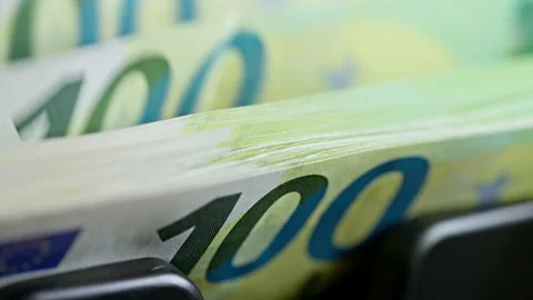 Euro banknotes processed by a money counting machine for financial audit, bookke Stock Footage 346494062