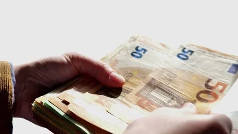 Euro banknotes recalculation. Large stack of euro banknotes in hands Stock Footage 294716000