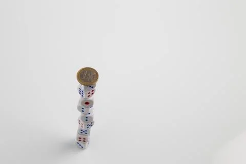 Euro coin on stack of dice Stock Photos