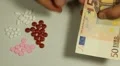 Euro EUR, Counting Drugs and Money, Health Care, Colorful Pills HD Footage
