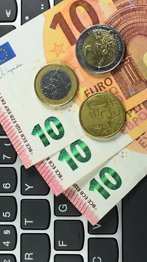 Euro Money on Computer Keyboard Vertical Video Stock Footage 340389600
