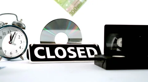 Euro notes falling beside video tape alarm clock and closed sign Video stock 41022727