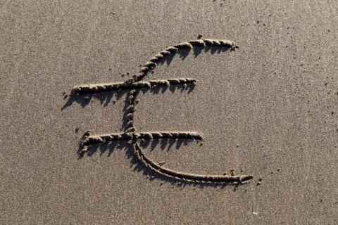 Euro in sand Stock Photos