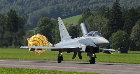 Eurofighter typhoon deploys parachute while landing on runway, handheld Stockbeeldmateriaal 249268556