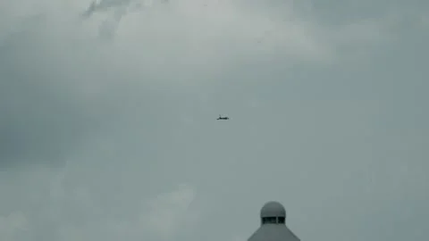 Eurofighter Typhoon Flying Beneath Dramatic Clouds Above City Buildings 库存影片 341676390