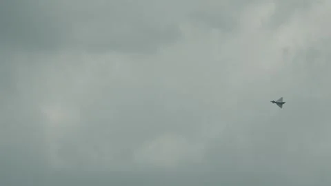 Eurofighter Typhoon Flying Through Overcast Clouds in Slow Motion Stock Footage 341676782