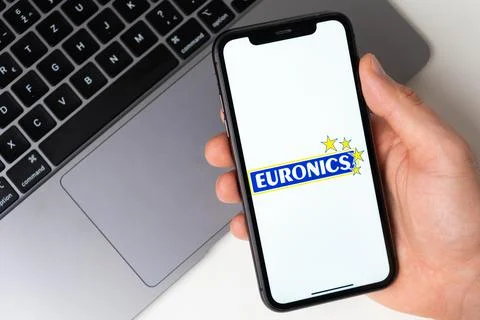 Euronics mobile application on the smartphone screen. Make purchases while Stock Photos