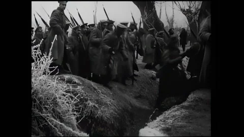 EUROPE - 1910s - Russian soldiers dig a trench and set up portable barbed wire. Stock Footage 296690153