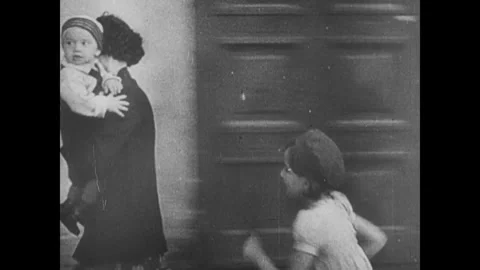 Europe 1940s: Shots of sirens, people running in street. Shots of empty city Stock Footage 341982353