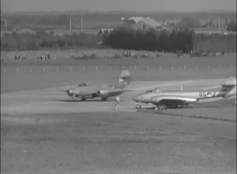 EUROPE - 1951: Painted codes - Crews stand among staggered jet rows Video stock 344487602