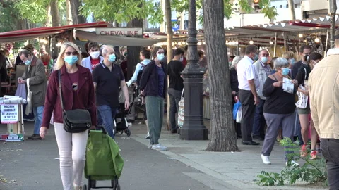 Europe coronavirus second wave, face masks at marketplace Paris France Stock Footage 139690445