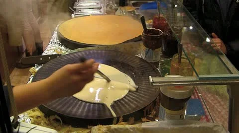 Europe German Christmas Advent Fair Market Xmas Crepes Pancake making Stock Footage