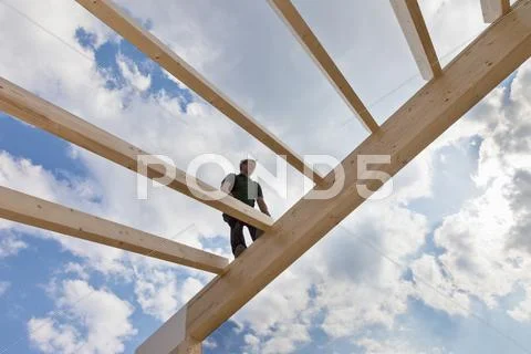 Europe, Germany, Rhineland Palantinate, Man standing on ridge purlin Stock Photos