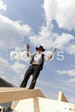 Europe, Germany, Rhineland Palantinate, Man standing on roof Stock Photos